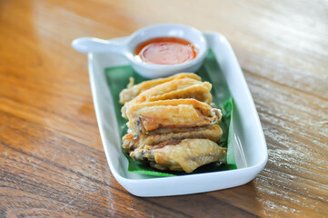 chicken wings or deep fried chicken , fried chicken and sauce