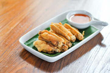 chicken wings or deep fried chicken , fried chicken and sauce