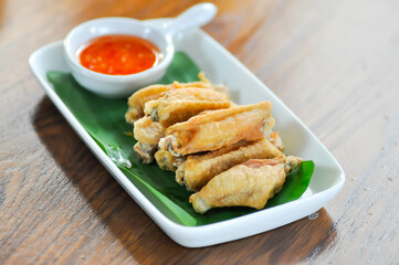 chicken wings or deep fried chicken , fried chicken and sauce