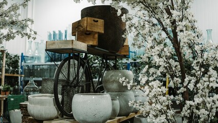 a group of pots sitting on top of a table in front of a planter