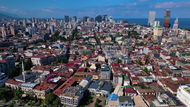 Drone footage of the cityscape of Batumi on a sunny day, Georgia with blue sky