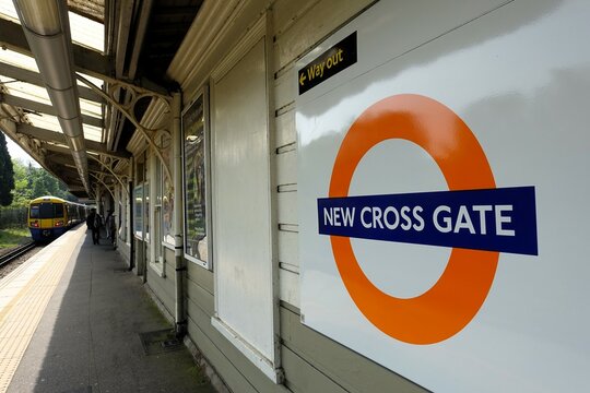 New Cross Gate railway station London Overground roundel sign on the platform