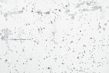 White background with abstract black paint splatters creating a dynamic and modern composition