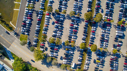 Aerial view of an full car parking along a mall center © jovannig
