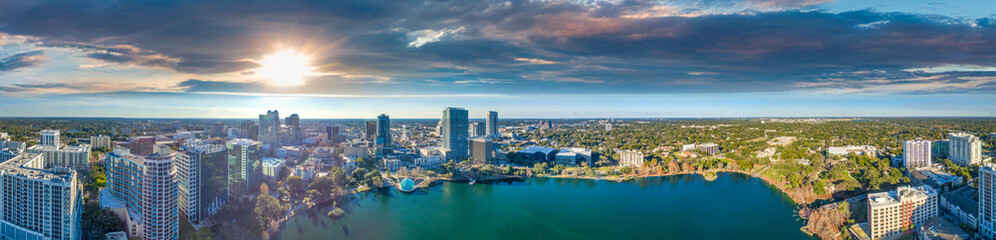 Panoramic aerial view of Orlando skyline along Lake Eola at sunset, Florida