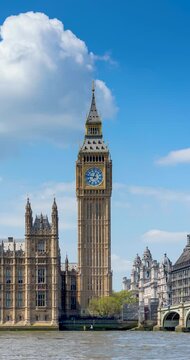 Time lapse view of the Big Ben clocktower in London, England, during a sunny summer day with light clouds