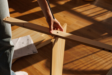 Self-assembly modern furniture by woman