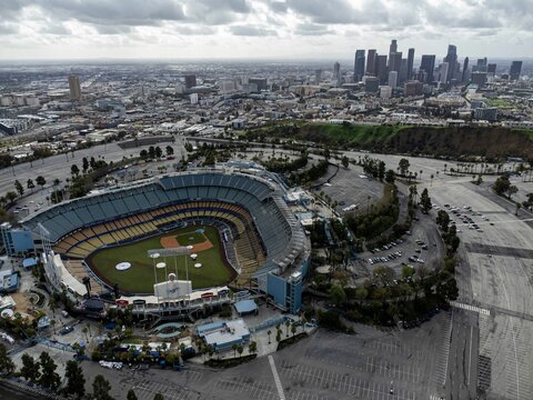 Aerial view of Dodger Stadium in Los Angeles, California, set against a the city's skyline