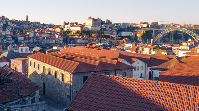 Panoramic view of Porto city and the famous Dom Luis I bridge, Portugal. Photo taked from WOW dictrict in Vilanova de Gaia. - Powered by Adobe