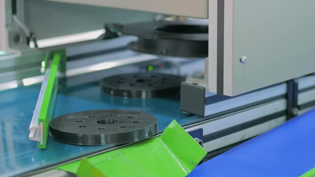 Sorting systems with cameras and lighting for inspecting workpieces and controlling components on conveyor belt - close up view. Concept of inspection, identification, measuring and quality control