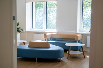 Interior of modern polyclinic, with light walls, light from the window.