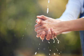 Person, outdoor and water for washing hands in nature for germs, health care and sanitation for...