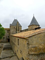 Carcassonne, May 2024: Visit the magnificent walled city of Carcassonne in Occitanie. Street photos - View of the fortified castle and ramparts protecting the historic town.
