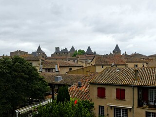 Obraz premium Carcassonne, May 2024: Visit the magnificent walled city of Carcassonne in Occitanie. Street photos - View of the historic town of Carcassonne