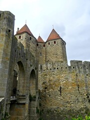 Carcassonne, May 2024: Visit the magnificent walled city of Carcassonne in Occitanie. Street photos - View of the fortified castle and ramparts protecting the historic town.