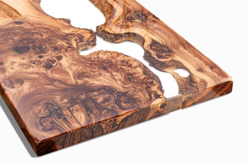 Live edge elm burl slab table top with central epoxy resin river on white background, combining...