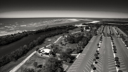Aerial view of an empty car parking along the sea