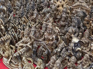 Sacred Treasures: Hindu God Bronze Statues Adorn a Vibrant Market