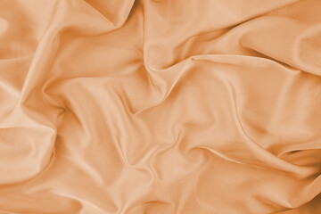 Orange chiffon fabric texture for background.