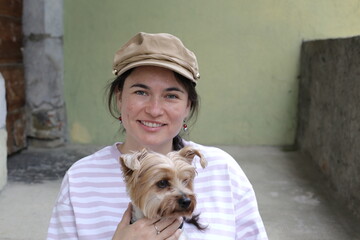 Yorkshire Terrier with her cute owner 