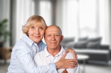 Happy senior old couple in living room