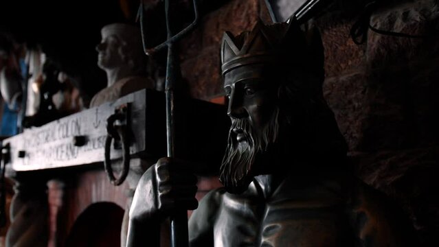 medium shot of ancient sculpture of man made of metal and bronze 60fps