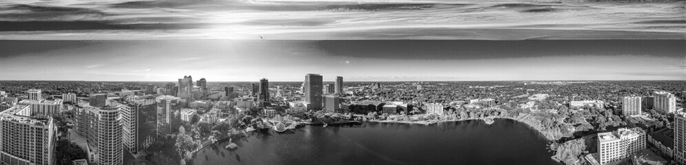 Panoramic aerial view of Orlando skyline along Lake Eola at sunset, Florida