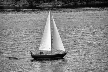 Sailing boat along the coastline of Vancouver Island, Canada