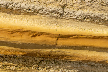Detail of the texture of the Etretat cliffs in the Normandie region of France in a sunny day. Falaise d'amont chalk clliffs in the Alabaster coast.
