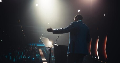 Honorary Politician Speaking at a College Campus. Lecturer Addressing Graduating Students at University Hall with American Flag. Encouraging Academic Career Development and Future Opportunities