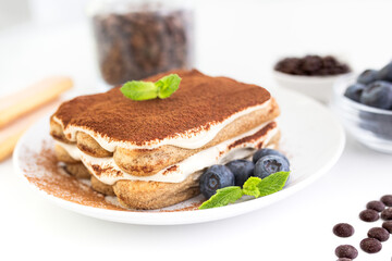 Homemade tiramisu cake . Food background. White background. Sweet Italian dessert .
 