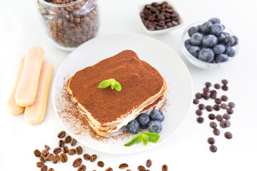 Homemade tiramisu cake . Food background. White background. Sweet Italian dessert .
 