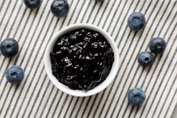 Blueberry Jam Preserves in a Bowl, top view. Flat lay, overhead.