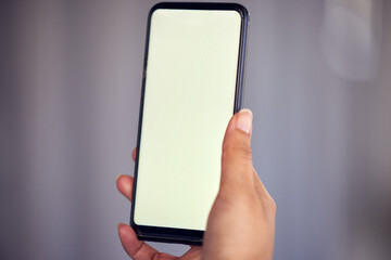 Hand, phone screen and social media with mockup space for advertising or marketing online. App, contact or display and person with mobile for communication, networking or internet research closeup