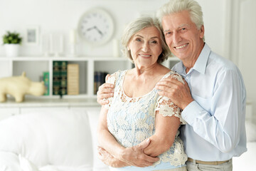 Obraz premium Close up portrait of senior couple posing at home