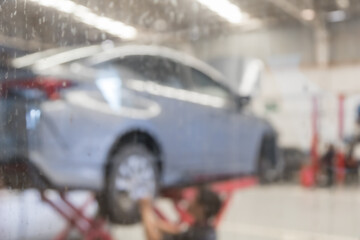 blured image of car service centre auto repair workshop