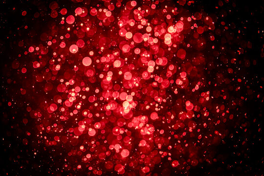 Blurred photo with red dots visible glittering, shining brightly look and feel luxurious