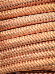 Close-up view of neatly bundled copper wires with natural patina and textures.