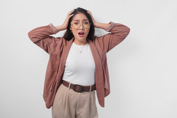 Sad Asian woman wearing eyeglasses looking stressed and depressed or having headache, isolated white background.