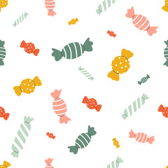 Seamless pattern with holiday candies in cute doodle style. Baby design with holiday clip art for wrapping paper, print, fabric, scrapbook. Bright festive background
