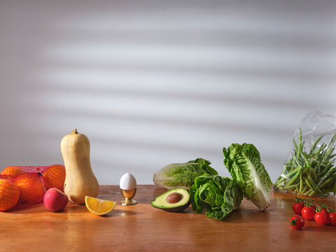 Fresh fruit and vegetables on a wooden counter