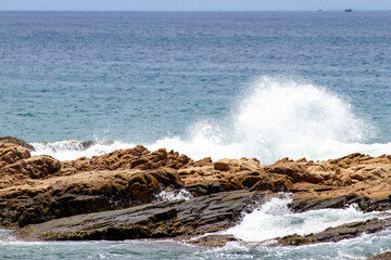Blue Waves Crashing On Rocks In Vietnam Coastal.