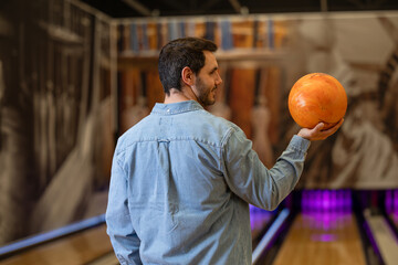 man holding a bowling ball