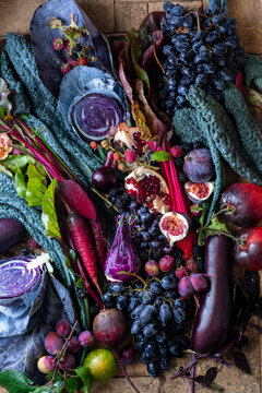 Autumn still life with vegetables and fruit in purple