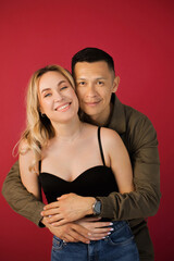 Portrait of a young positive, cheerful, international couple