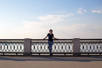 Portrait female tourist on the banks of the Volga River.