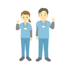 人差し指を立てるポーズをする青系のスクラブを着用した医療従事者の男女（正面を向いて笑顔全身）　
