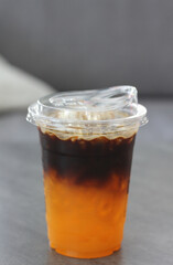 Iced orange Americano in the cafe