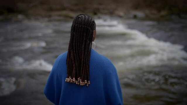 Young African Woman with Cornrows Braids Hair Style Enjoying Nature Outdoors
