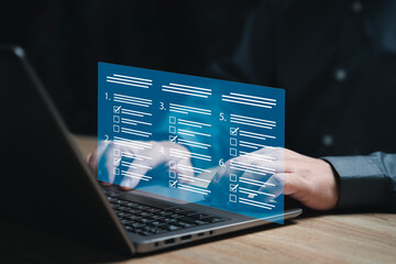 Performance checklist digital assessment survey online concept, Businessman use laptop Answer...